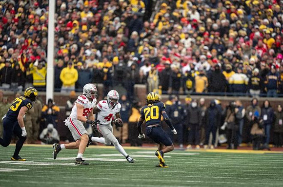 Cole Sullivan (23) and Jyaire Hill (20)