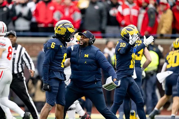 Brandyn Hillman (6), Sherrone Moore, Zeke Berry (10), and Jimmy Rolder (30)