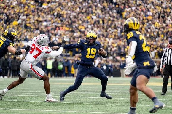 Jake Guarnera (53), Bryce Underwood (19), and Jordan Marshall (23)