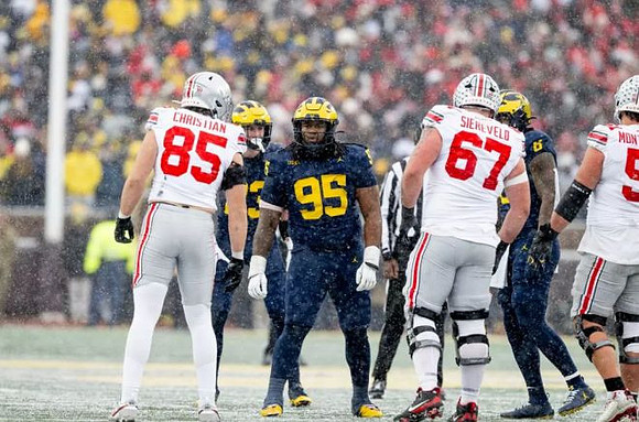 Cole Sullivan (23), Trey Pierce (95), and Derrick Moore (8)