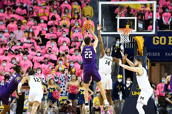 DeVante' Jones (12), Moussa Diabate (14), and Hunter Dickinson (1)