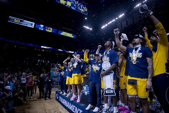 Dusty May, Michigan Team, and Big Ten Tournament Championship Trophy