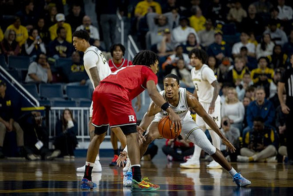 Yaxel Lendeborg (23), Nimari Burnett (4), and Elliot Cadeau (3)