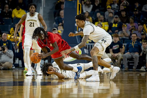 Morez Johnson Jr. (21), Elliot Cadeau (3), and Yaxel Lendeborg (23)