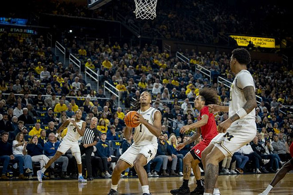 Nimari Burnett (4), Trey McKenney (1), and Yaxel Lendeborg (23)
