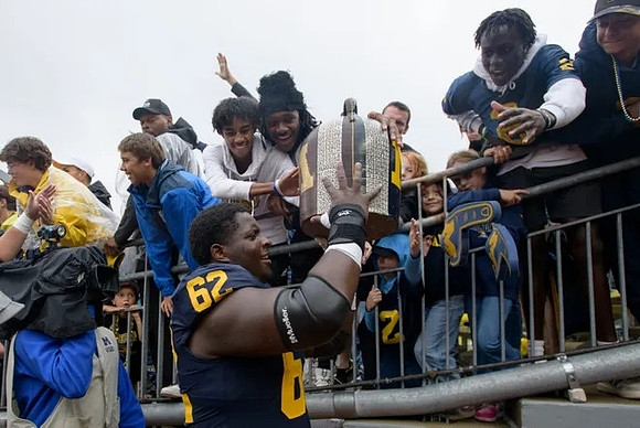Raheem Anderson (62) and The Little Brown Jug