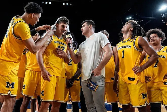 Will Tschetter (42) and Michigan Team
