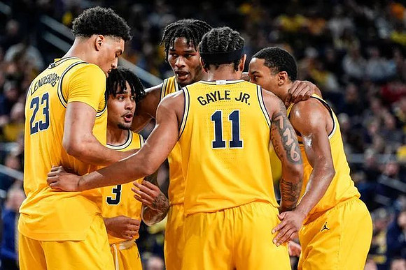 Yaxel Lendeborg (23), Elliot Cadeau (3), Morez Johnson Jr. (21), Nimari Burnett (4), and Roddy Gayle Jr. (11)