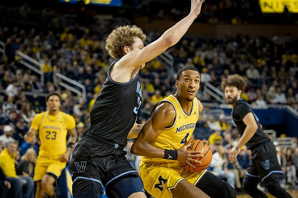 Yaxel Lendeborg (23) and Nimari Burnett (4)