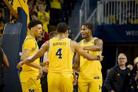 Yaxel Lendeborg (23), Nimari Burnett (4), and Morez Johnson Jr. (21)