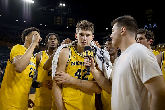 Will Tschetter (42) and Michigan Team