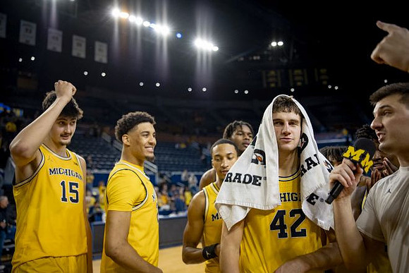 Will Tschetter (42) and Michigan Team