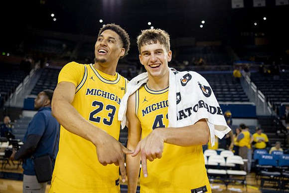 Yaxel Lendeborg (23) and Will Tschetter (42)