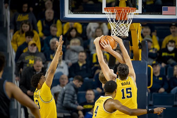 Yaxel Lendeborg (23), Nimari Burnett (4), and Aday Mara (15)