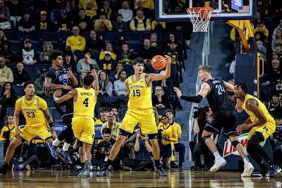 Yaxel Lendeborg (23), Nimari Burnett (4), Aday Mara (15), and Morez Johnson Jr. (21)