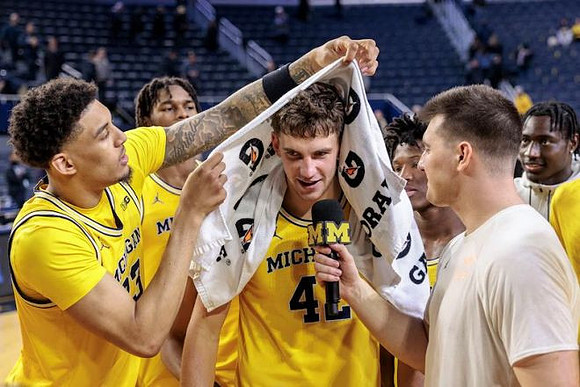 Yaxel Lendeborg (23), Will Tschetter (42), Morez Johnson Jr. (21), and L.J. Cason (2)