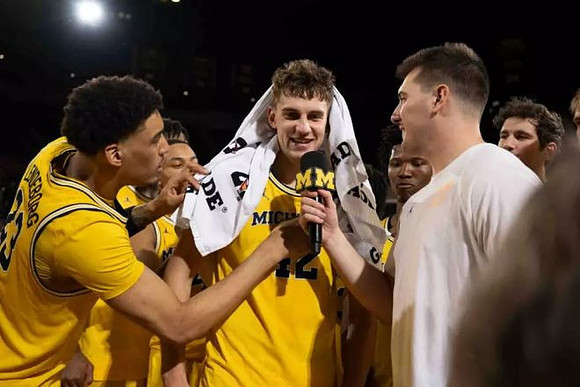 Will Tschetter (42) and Michigan Team