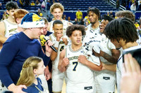 Howard Eisley Jr. (7) and Michigan Team