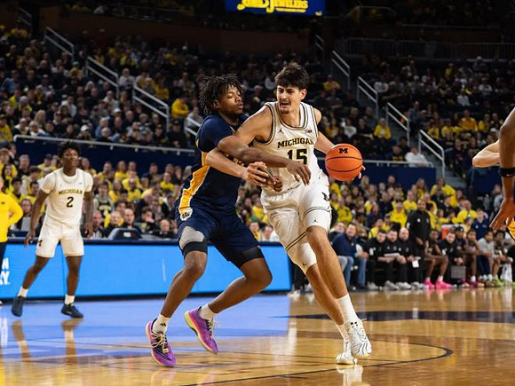 L.J. Cason (2) and Aday Mara (15)