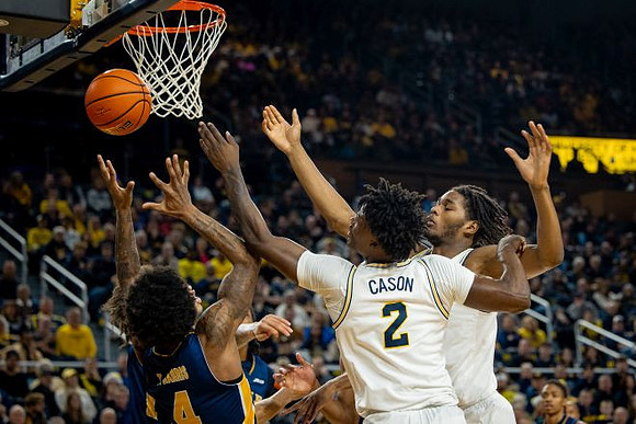 L.J. Cason (2) and Morez Johnson Jr. (21)