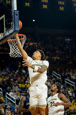 Yaxel Lendeborg (23) and Morez Johnson Jr. (21)
