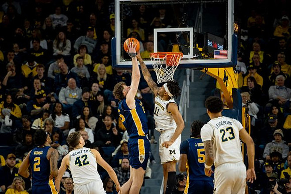 Will Tschetter (42), Roddy Gayle Jr. (11), and Yaxel Lendeborg (23)