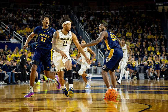 Roddy Gayle Jr. (11), Nimari Burnett (4), and Morez Johnson Jr. (21)