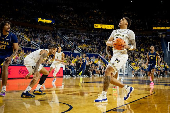 Roddy Gayle Jr. (11), Nimari Burnett (4), and Yaxel Lendeborg (23)