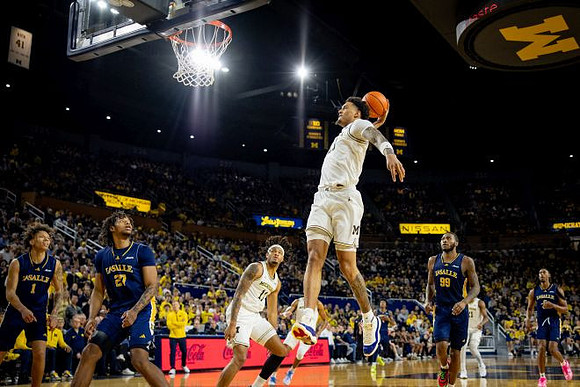 Roddy Gayle Jr. (11), Yaxel Lendeborg (23), and Morez Johnson Jr. (21)