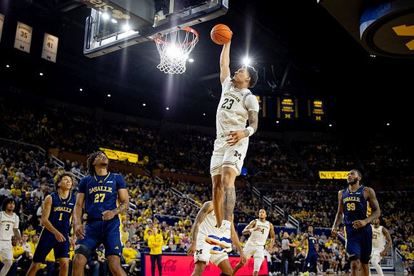 Yaxel Lendeborg (23), Nimari Burnett (4), and Morez Johnson Jr. (21)