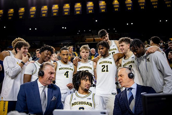 Tim McCormick, Elliot Cadeau (3), and Michigan Team