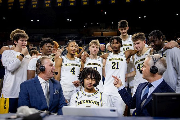 Tim McCormick, Elliot Cadeau (3), and Michigan Team