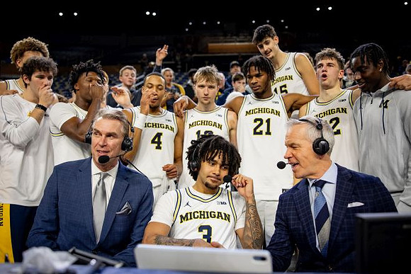 Tim McCormick, Elliot Cadeau (3), and Michigan Team