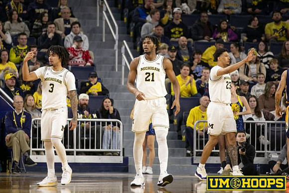 Elliot Cadeau (3), Morez Johnson Jr. (21), and Yaxel Lendeborg (23)