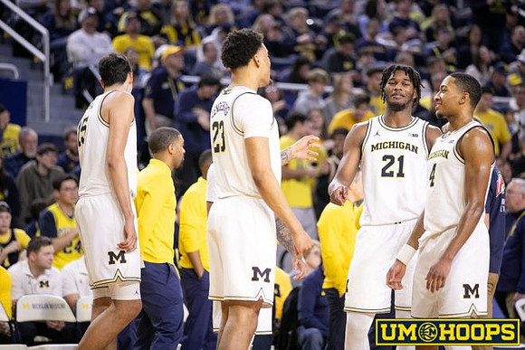 Aday Mara (15), Yaxel Lendeborg (23), Morez Johnson Jr. (21), and Nimari Burnett (4)