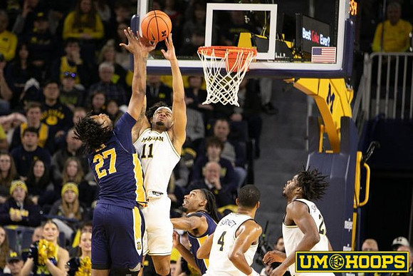 Roddy Gayle Jr. (11), Nimari Burnett (4), and Morez Johnson Jr. (21)