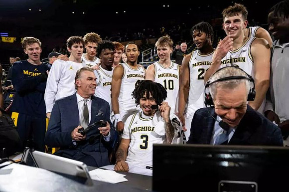 Tim McCormick, Elliot Cadeau (3), and Michigan Team
