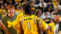 Trey McKenney (1), L.J. Cason (2), and Michigan Team