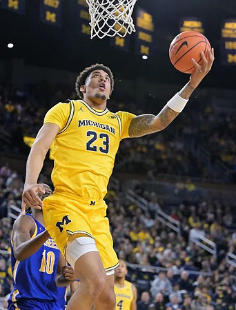 Yaxel Lendeborg (23) and Nimari Burnett (4)