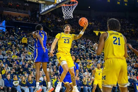 Yaxel Lendeborg (23), Nimari Burnett (4), and Morez Johnson Jr. (21)