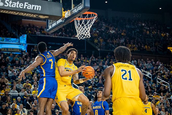 Yaxel Lendeborg (23), Morez Johnson Jr. (21), and Nimari Burnett (4)