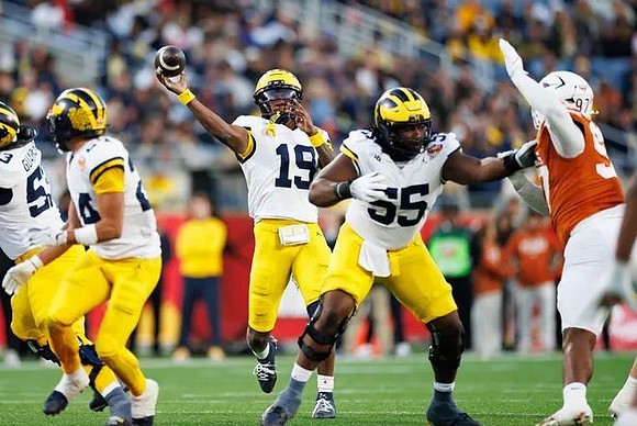 Jake Guarnera (53), Jalen Hoffman (42), Bryce Underwood (19), and Nathan Efobi (55)