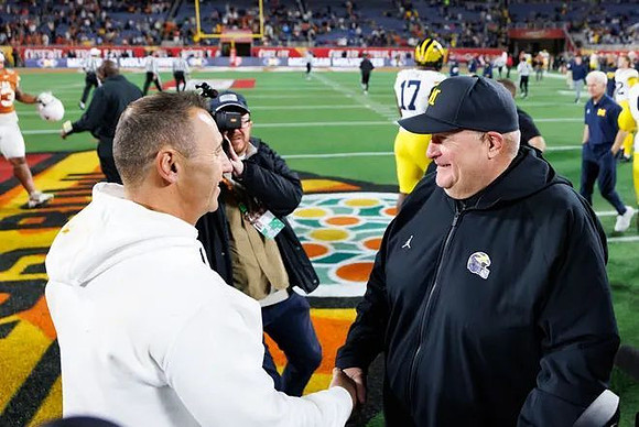 Texas Head Coach Steve Sarkisian and Acting Head Coach Biff Poggi