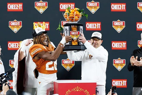 Texas Head Coach Steve Sarkisian and Citrus Bowl Trophy