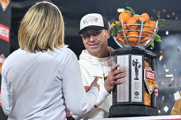 Texas Head Coach Steve Sarkisian and Citrus Bowl Trophy