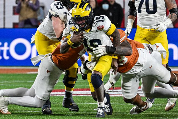 Jake Guarnera (53), Bryce Underwood (19), and Brady Norton (70)
