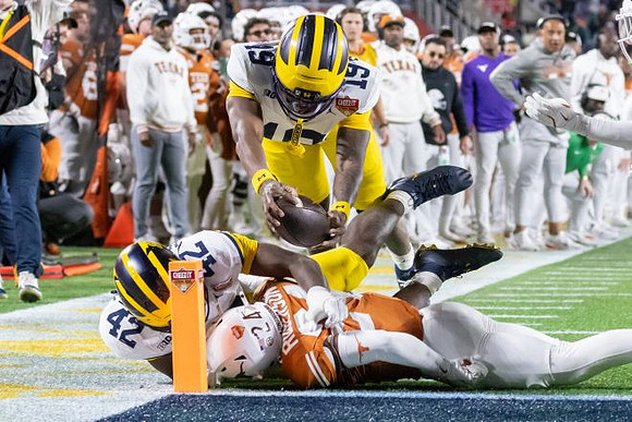 Jalen Hoffman (42) and Bryce Underwood (19)