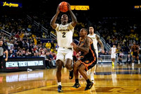 L.J. Cason (2) and Elliot Cadeau (3)