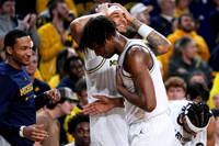 Nimari Burnett (4), Yaxel Lendeborg (23), and Morez Johnson Jr. (21)