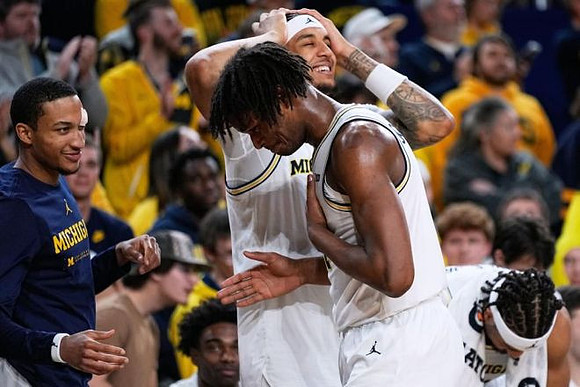 Nimari Burnett (4), Yaxel Lendeborg (23), and Morez Johnson Jr. (21)